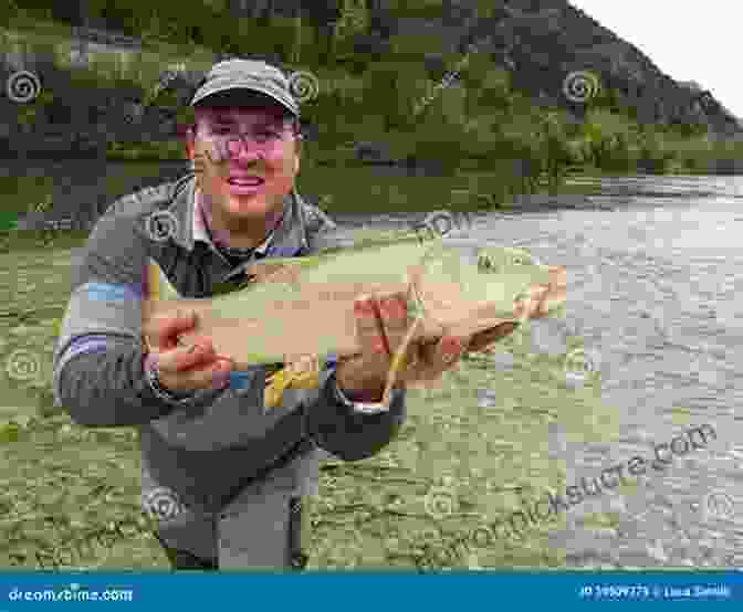 A Young Fisherman Holds Up A Fish That He Has Just Caught, The River Flowing Behind Him. Sidetracks: 40 True Stories Of Hunting And Fishing On Paths Less Traveled (The Sidetracks Series)